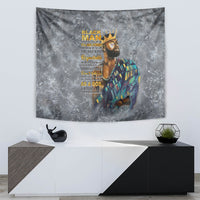 Mounted gray tapestry with crowned face portrait, multicolor robe, and yellow motivational text
