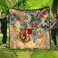 Tan tropical quilt with colorful blooms, blue anchor motif, and scalloped border trim
