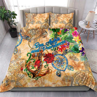 Orange tropical bedding set featuring patterned duvet and two pillowcases on sofa bed