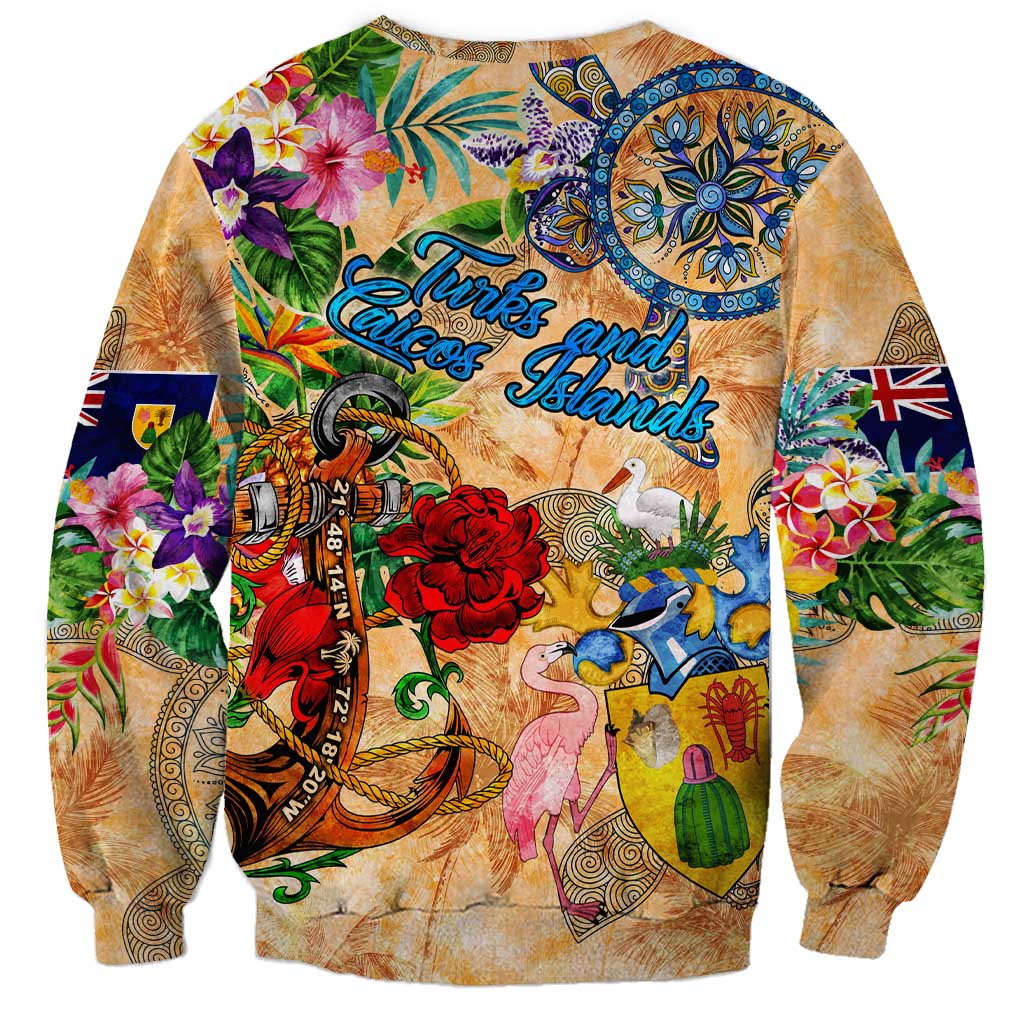 Orange unisex sweatshirt, rear view with anchor, tropical flowers, and Turks & Caicos Islands print