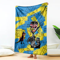 Psychedelic blue and yellow skull-face art blanket, shown draped over a standing support