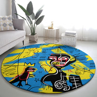 Round area rug with bright blue and yellow psychedelic artwork featuring two cartoon skulls