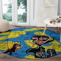 Round blue and yellow graphic area rug with central black skull figure and red accents