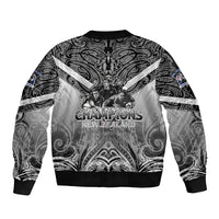 Black unisex bomber jacket with ornate paisley print and Champions graphic on back