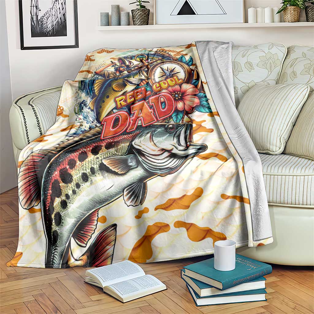 Beige bass fishing blanket with reel, jumping fish, and Reel Cool Dad text