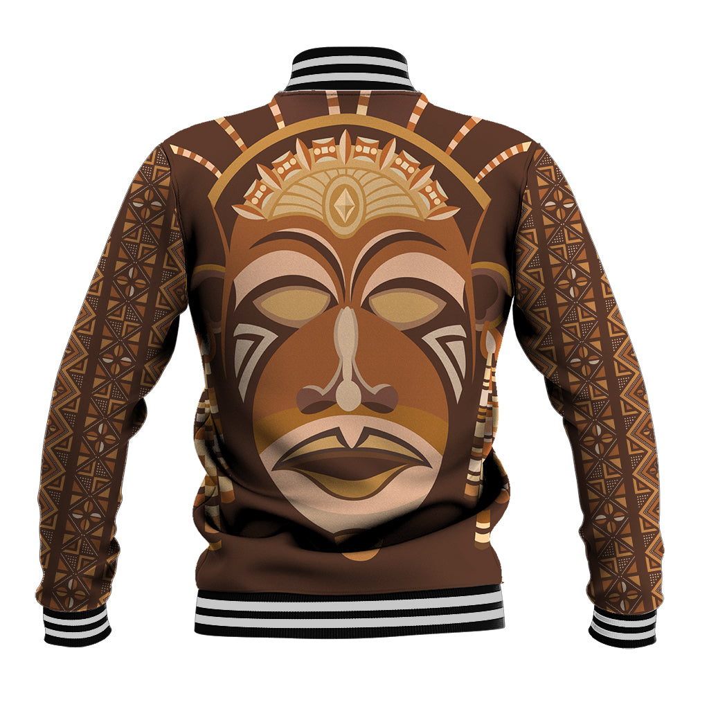 Brown unisex baseball jacket with tribal face graphic, striped ribbed hem and cuffs