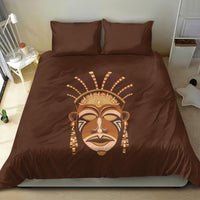 Brown bedding set with tribal face mask print on duvet and matching pillows