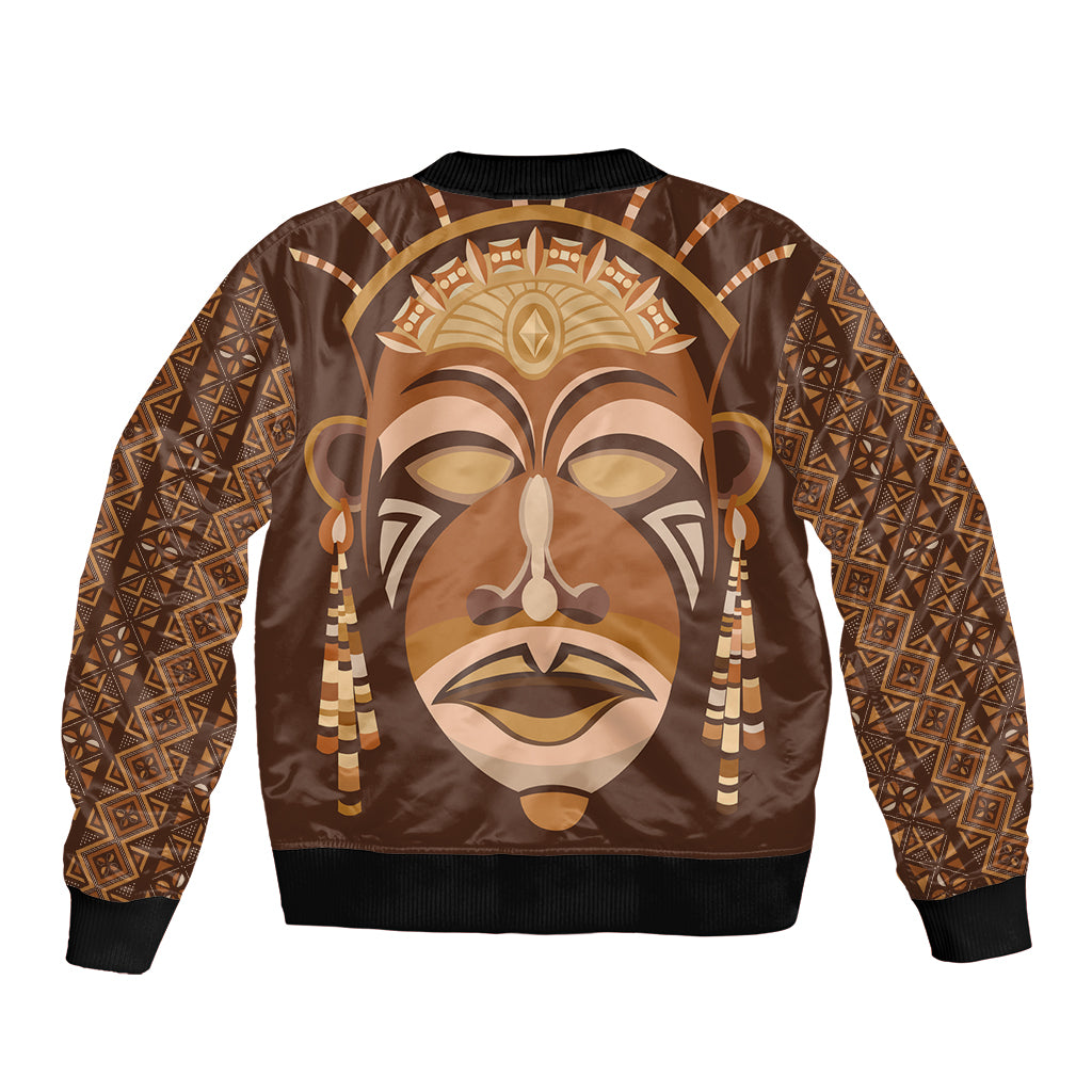 Bomber jacket with large tribal mask print, brown/gold tones, ribbed cuffs and waistband