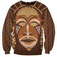 Brown sweatshirt with tribal face mask graphic and long sleeves