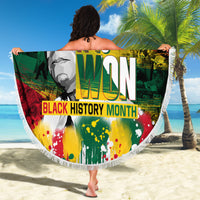Round beach blanket with fringe edge held on sand, Black History Month portrait text graphic