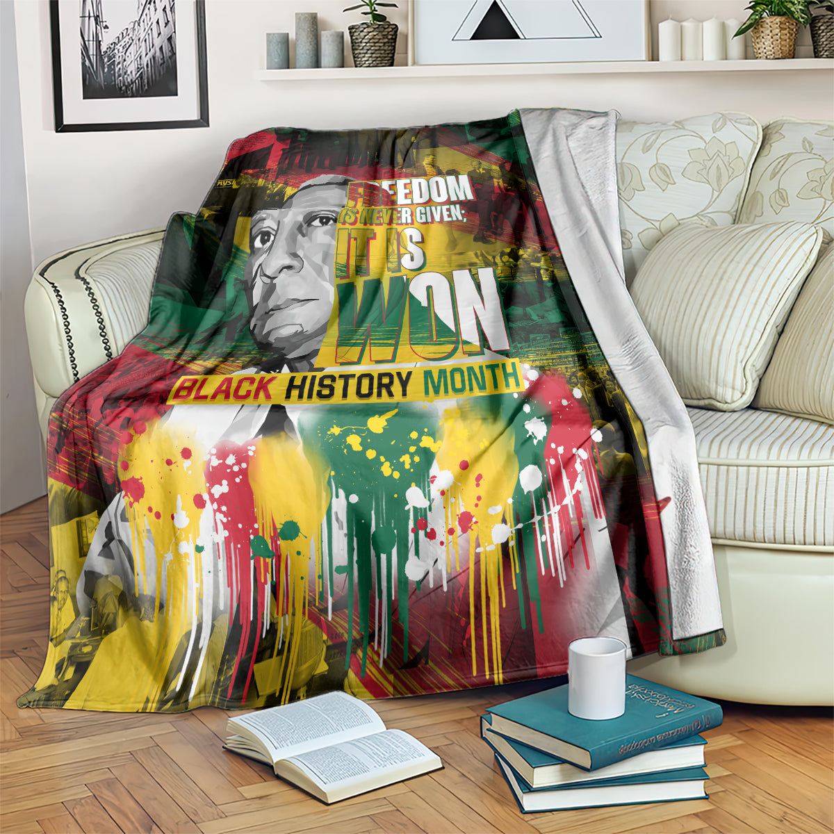 Black history graphic blanket with face portrait in red, green, yellow and paint splashes