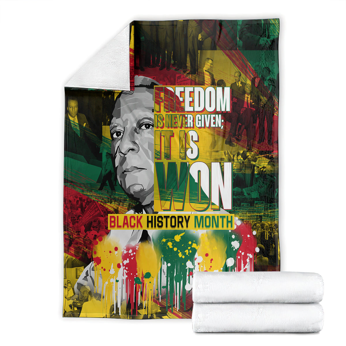 Black history portrait blanket shown with folded white towels, red green yellow lettering and splashes