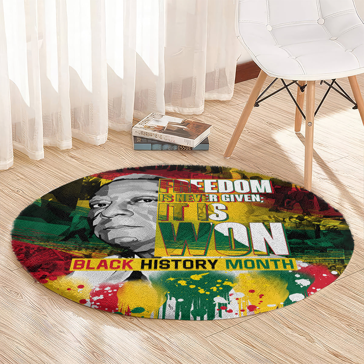 Round carpet with portrait image, “Freedom Is Never Given…” and “Black History Month” words.
