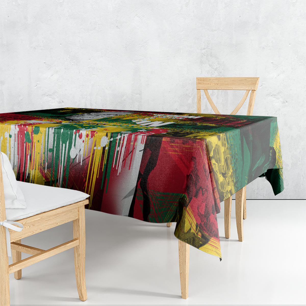 Colorful art-print tablecloth draped over a table with graphic stripes and splatter