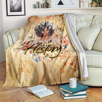 Beige floral throw blanket with woman portrait and decorative 'Black' text