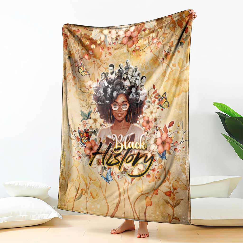Beige floral portrait throw blanket with butterfly details and 'Black' lettering