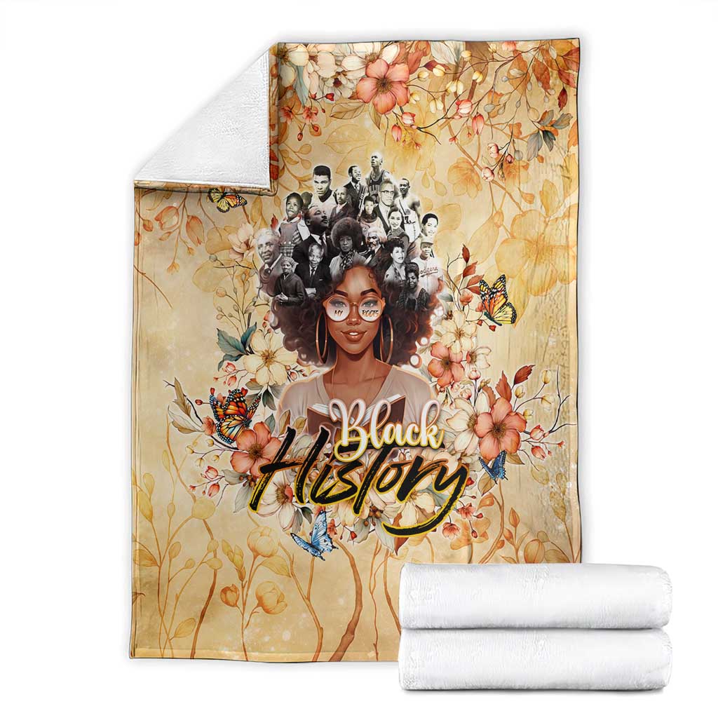 Beige floral throw blanket with woman portrait, butterflies, and 'Black' lettering