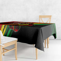 Tablecloth edge drape with black fabric and red-green graphic band near corner