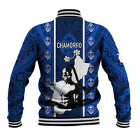 Blue zip-up baseball jacket with striped ribbed collar and Chamorro graphic on back