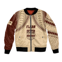 Beige bomber jacket with tapa-style geometric print, zip front, ribbed cuffs