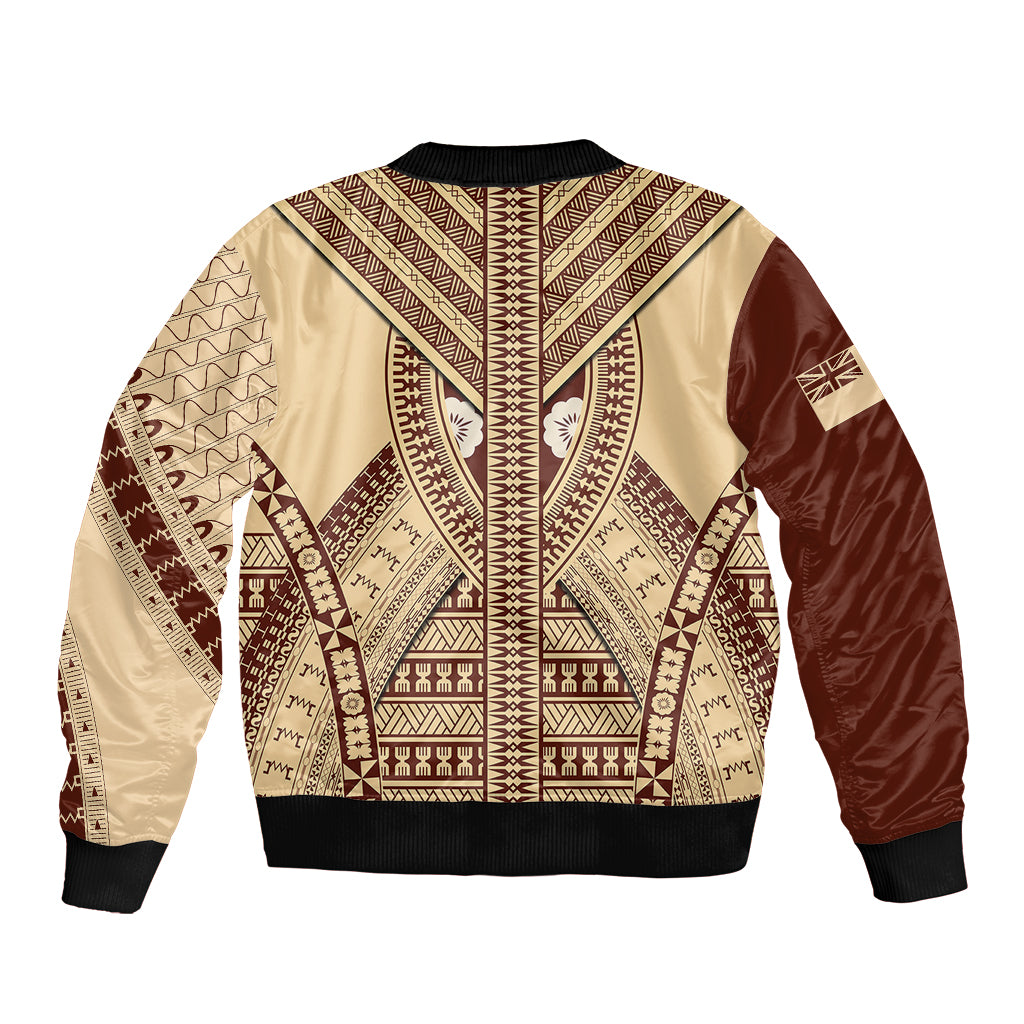 Beige bomber jacket with brown tapa pattern, black ribbed collar and cuffs
