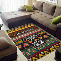 Colorful African-style geometric rug with triangle motifs and stacked slogan text