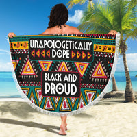 Round beach blanket with colorful African print, fringe edge, held for display