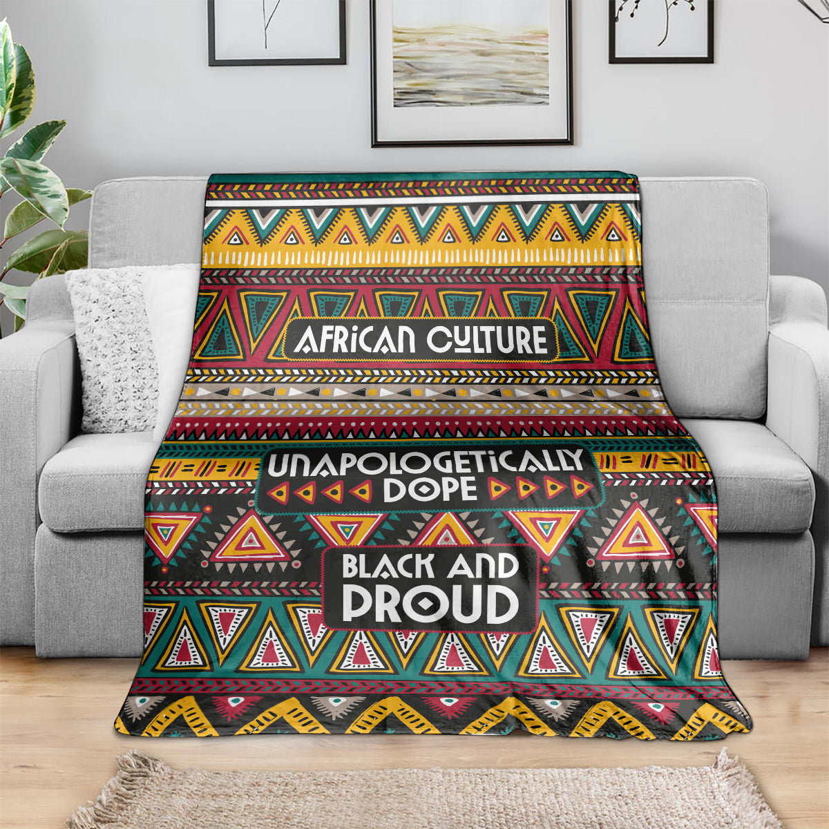Colorful African pattern blanket with “AFRICAN CULTURE” and “BLACK AND PROUD” text on couch