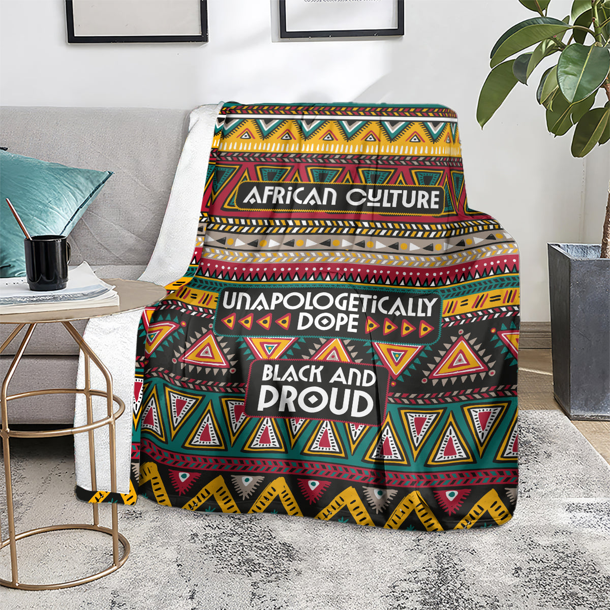 Colorful African culture blanket draped on a gray couch, featuring geometric triangle designs