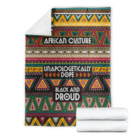 Folded African pattern blanket with “AFRICAN CULTURE” and “BLACK AND PROUD” text, stacked towels