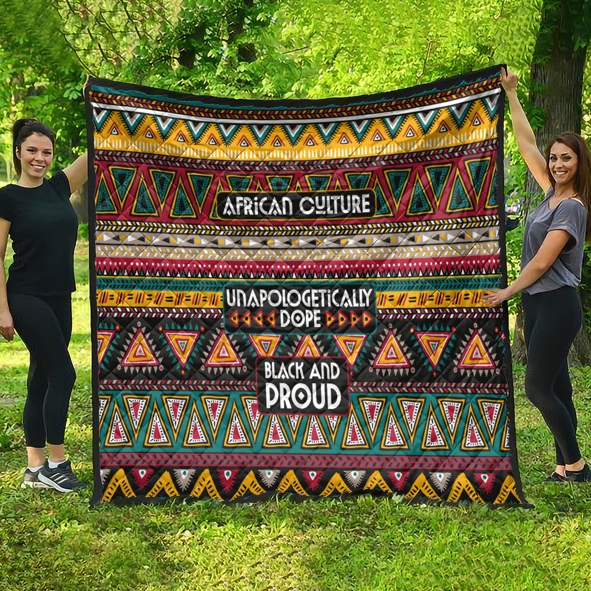 Colorful African-pattern quilt featuring geometric triangles and centered text: “African Culture” and “Black and Proud.”