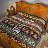 Colorful African-pattern quilt spread over a bed, showing “African Culture” and “Black and Proud” text.