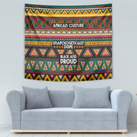 Colorful African-pattern tapestry wall hanging with teal, red, yellow geometric borders.