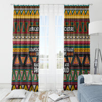 Paired African pattern window curtains with a white sheer center panel and geometric trim