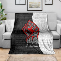 Gray blanket with red justice fist graphic, repeating text pattern, custom name