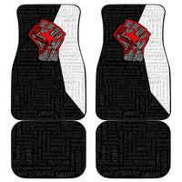 Set of four black car mats with white inserts and red justice fist emblem