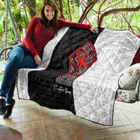 Personalized civil rights movement quilt draped on couch, black-and-white with red fist graphic