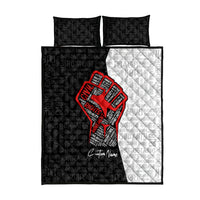 Reversible quilt bed set: black and white typography with red raised-fist center