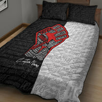 Black and white quilt bed set with red raised-fist motif and cursive signature print