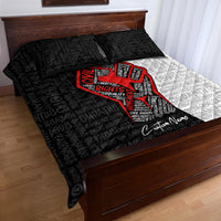 Quilt bed set with black and white typography, red raised-fist print, two dark pillows
