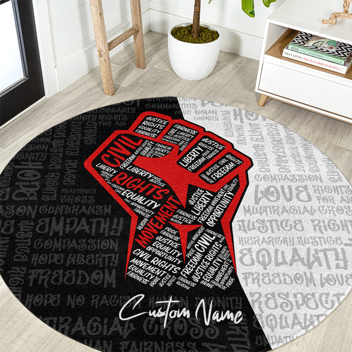 Round justice-themed carpet close-up: red raised-fist graphic on black/gray repeating text