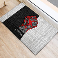 Personalized civil rights doormat featuring red justice fist centered on word-pattern background