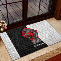 Personalized civil rights entrance doormat with red justice fist and repeating word text design