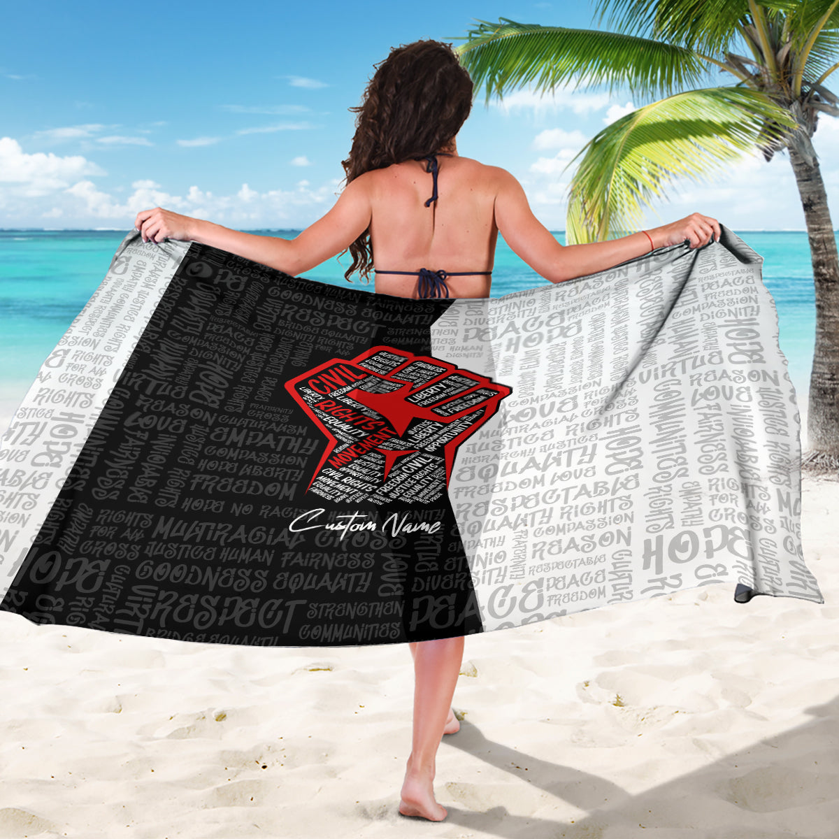 Black and light-gray sarong with red justice-fist graphic and patterned text print