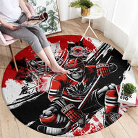 Red and black round hockey graphic area rug with skull goalie and stick design