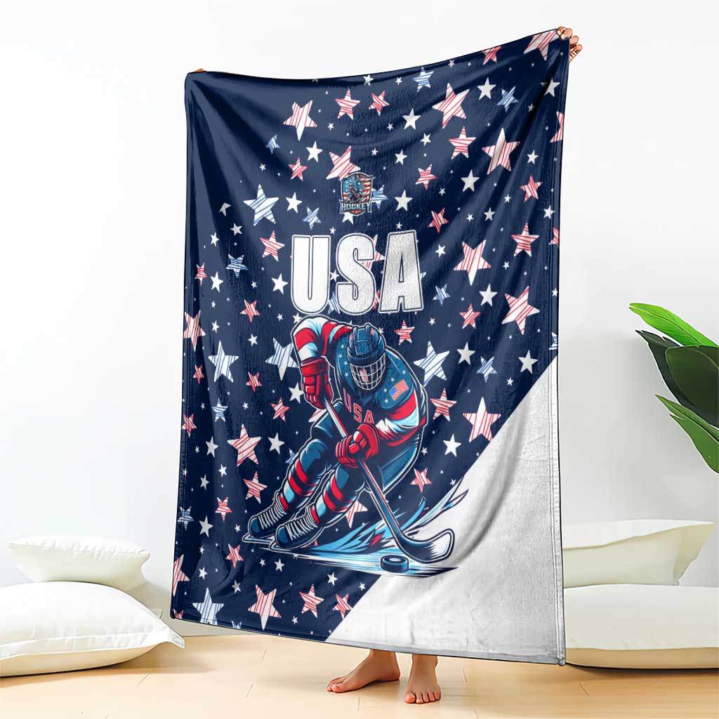 USA ice hockey blanket draped on bed, navy with USA text, stars, and goalie illustration