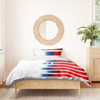 White duvet with red-and-blue diagonal USA stripe graphic and U.S.A text, two pillows