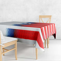 USA soccer tablecloth draped on dining table; red and white stripes with blue panel