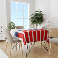 USA soccer tablecloth over dining table; red and white stripes with blue crest detail