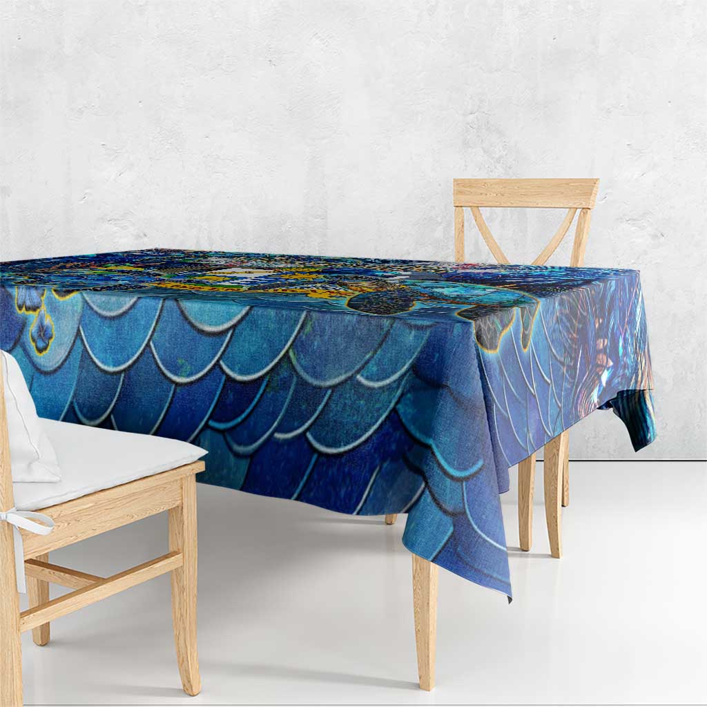 Blue scallop-scale tablecloth with matching drape over bench seating